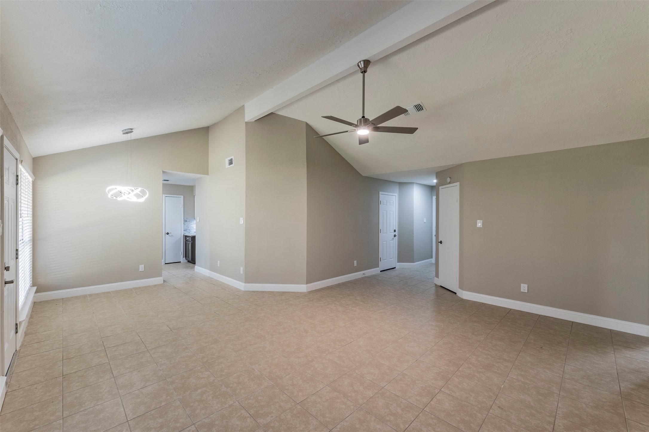21022 Waymare Lane Spring, TX 77388 - Photo 10 of 29 a view of an empty room with a chandelier fan