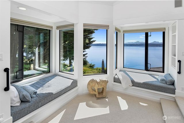 a living room with couch and a large window