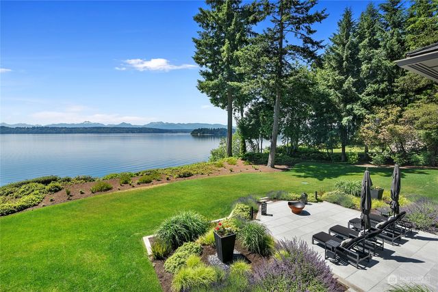 a view of a garden with houses in the background