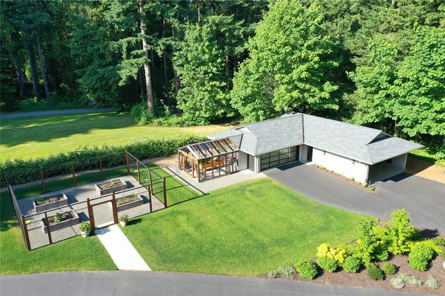a living room with furniture and a bed