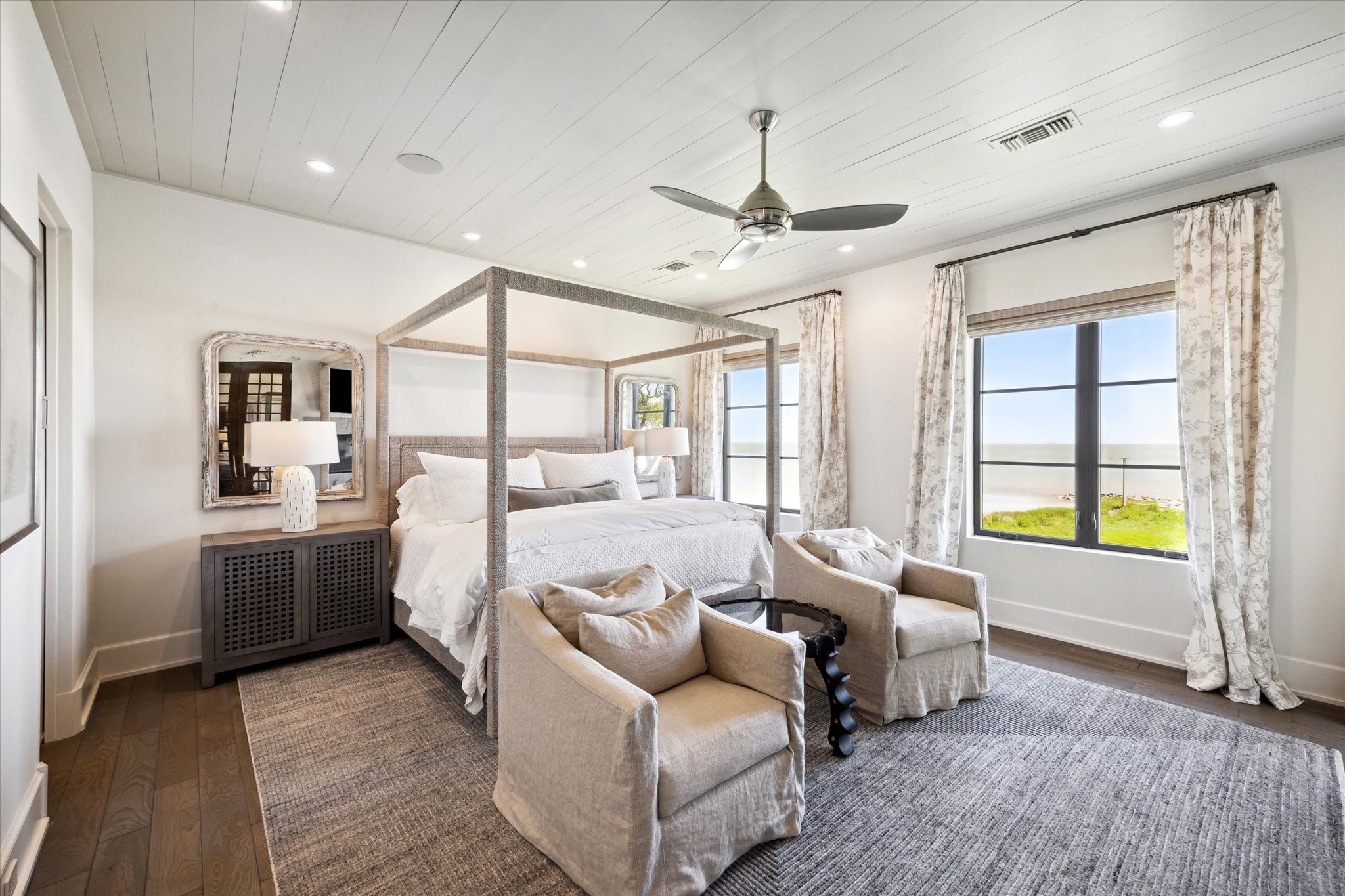 633 Quintana Roo Place Seabrook, TX 77586 - Photo 20 of 47 Retreat to the primary suite and experience true luxury. Notice the view of the bay!