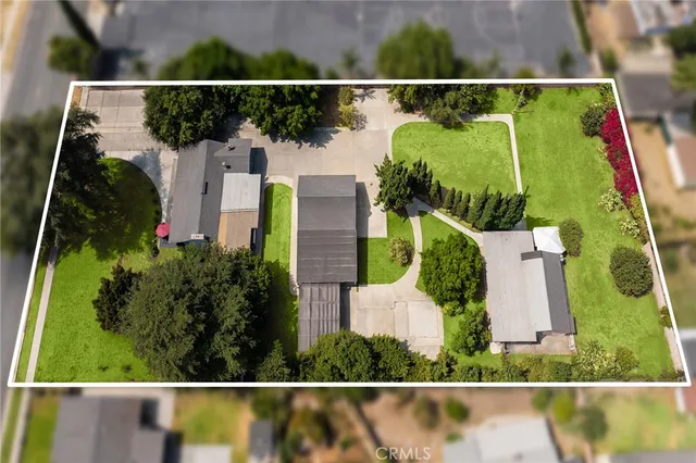 a view of a house with backyard porch and sitting area