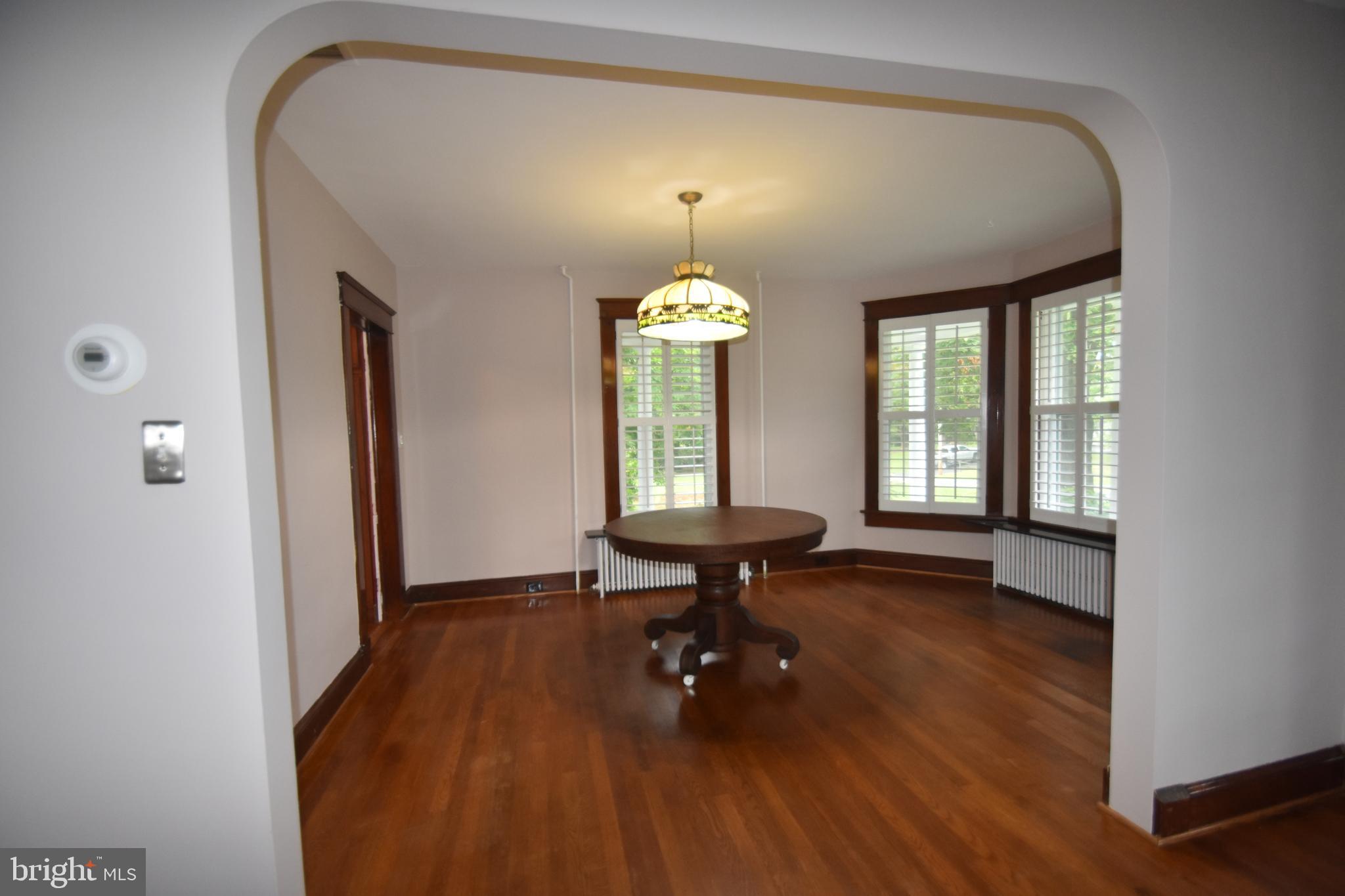 5619 A Jefferson Pike Frederick, MD 21703 - Photo 16 of 57 a view of a room with wooden floor and furniture