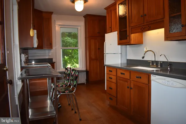 a kitchen with a stove and a microwave