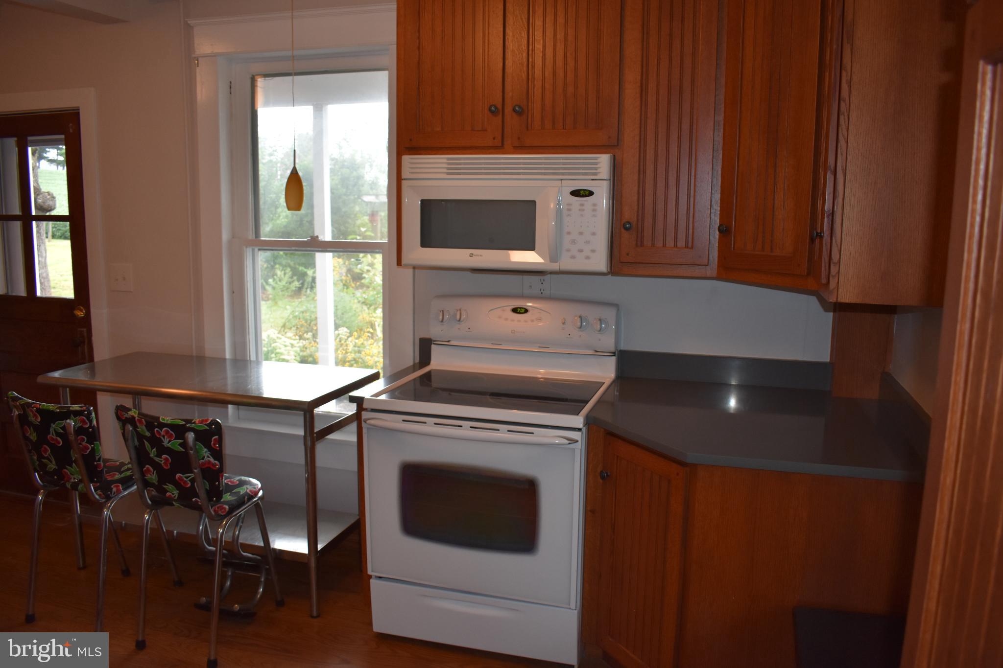 5619 A Jefferson Pike Frederick, MD 21703 - Photo 20 of 57 a kitchen with a stove and a microwave