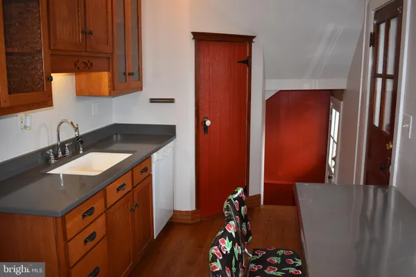 a kitchen with stainless steel appliances a stove a sink and a microwave