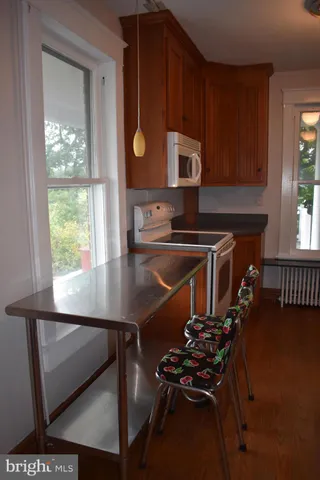 a kitchen with sink cabinets and window
