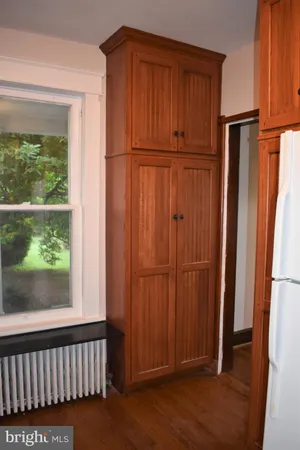 a kitchen with stainless steel appliances granite countertop a refrigerator a sink and a stove