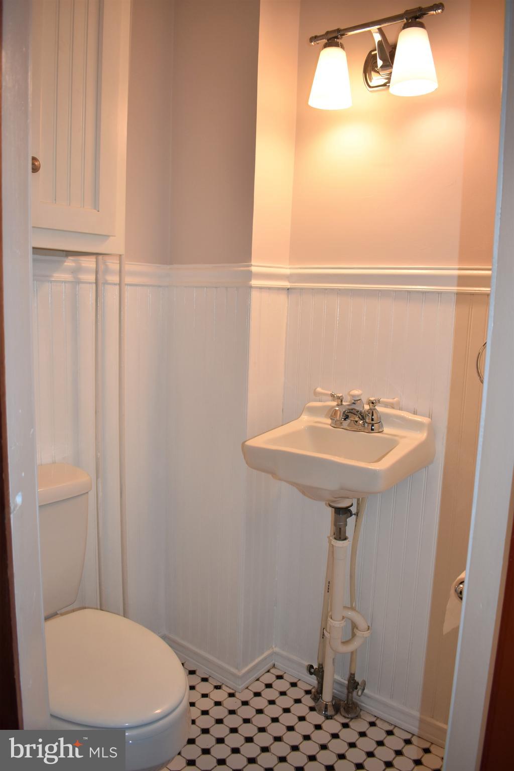 5619 A Jefferson Pike Frederick, MD 21703 - Photo 29 of 57 a bathroom with a sink a toilet a mirror and shower