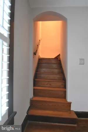 wooden floor in an empty room with a gallery