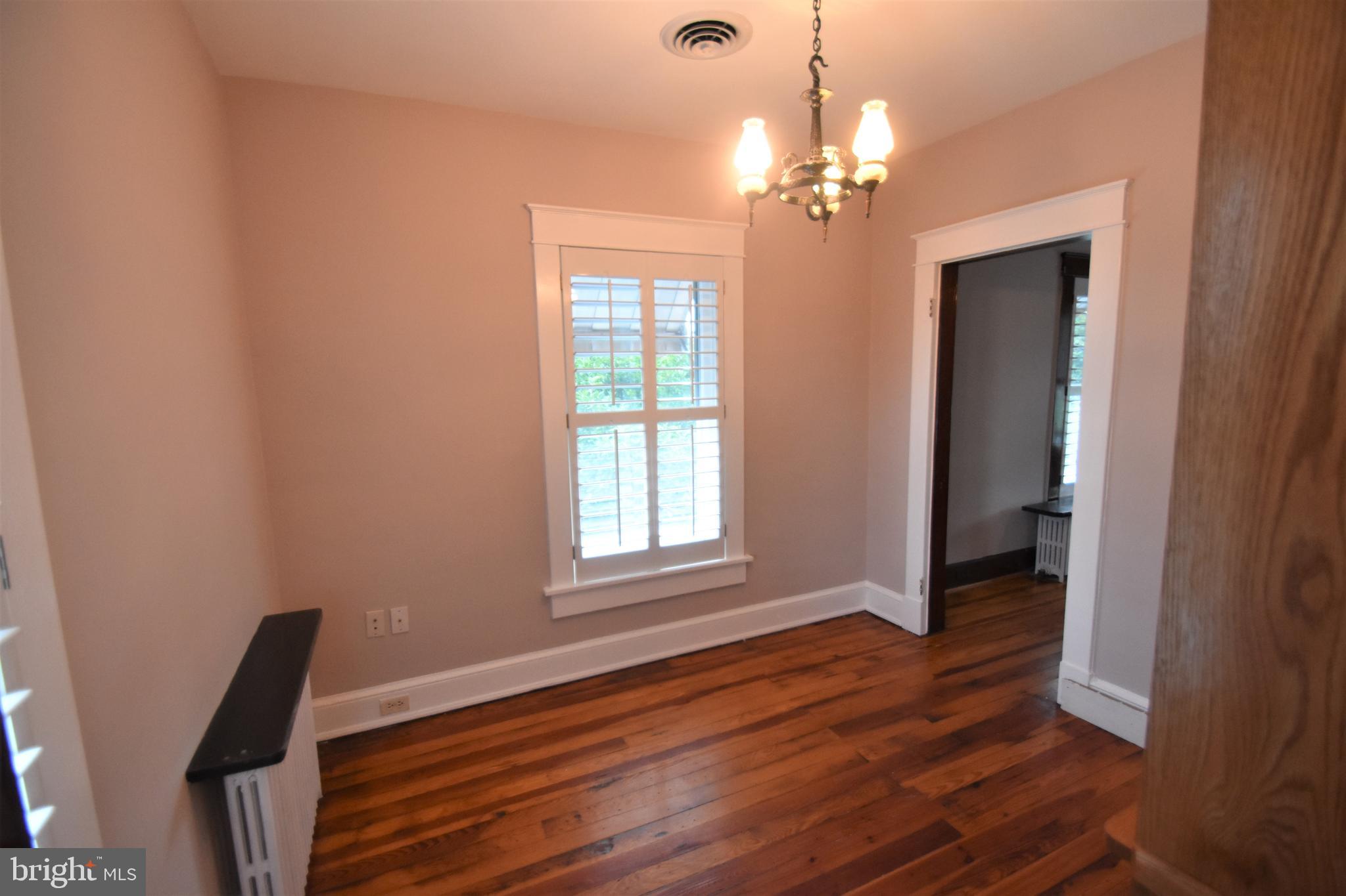 5619 A Jefferson Pike Frederick, MD 21703 - Photo 32 of 57 a view of a room with wooden floor and chandelier