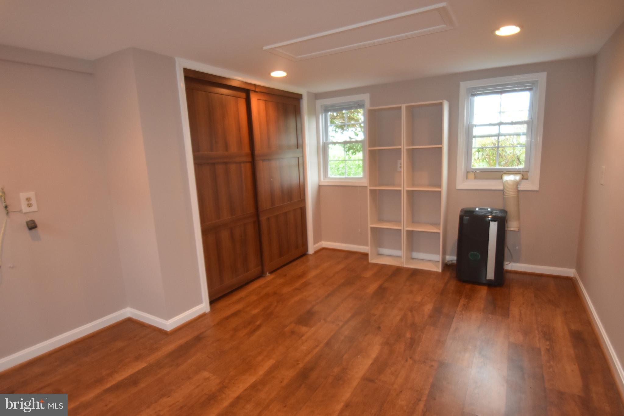 5619 A Jefferson Pike Frederick, MD 21703 - Photo 44 of 57 an empty room with wooden floor and a window