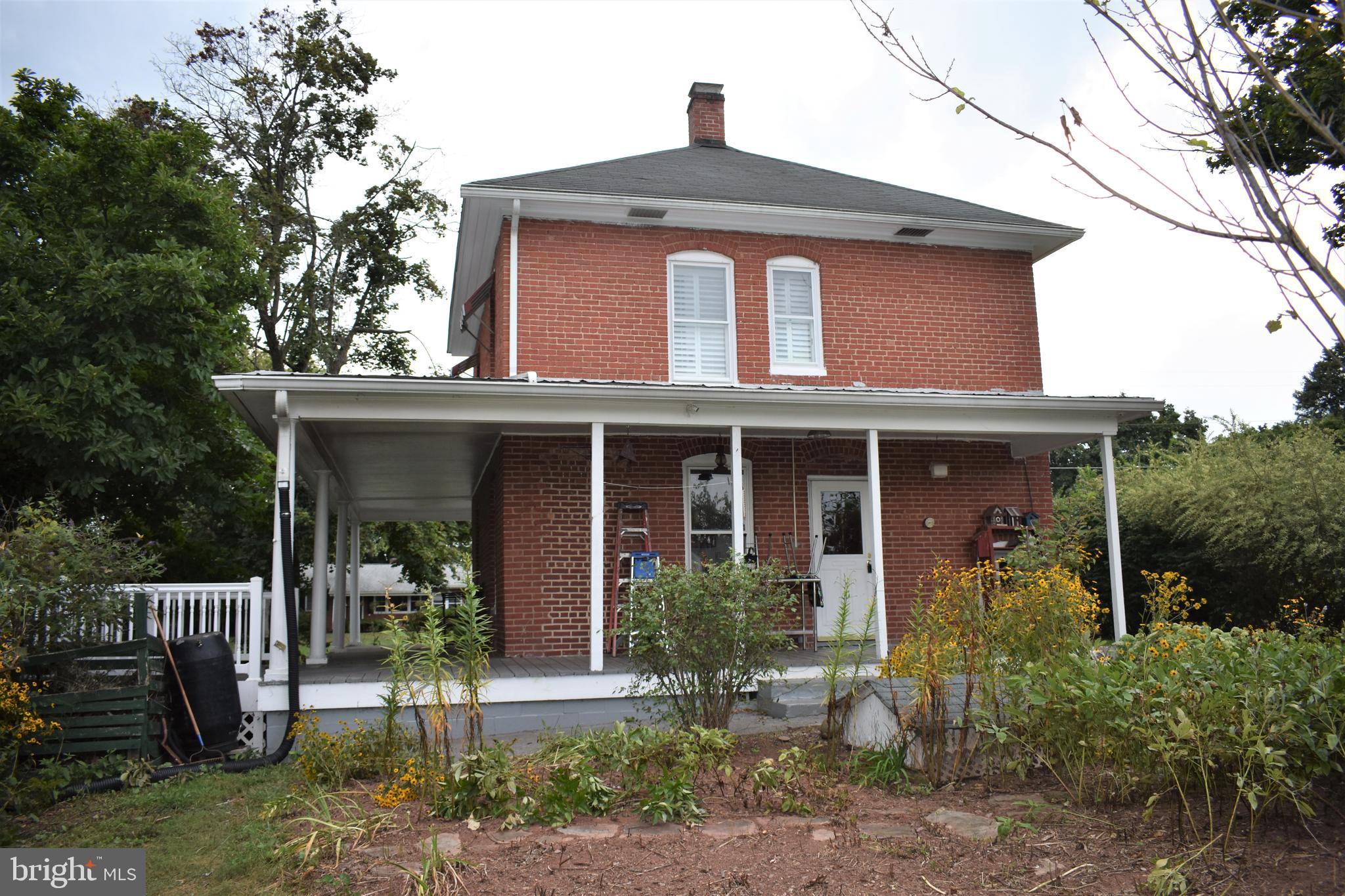 5619 A Jefferson Pike Frederick, MD 21703 - Photo 50 of 57 a front view of a house with garden