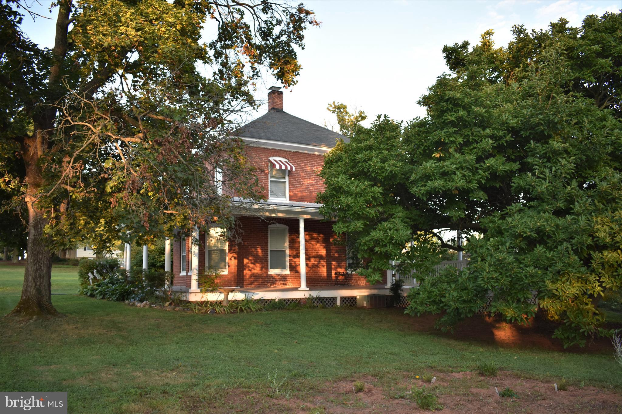 5619 A Jefferson Pike Frederick, MD 21703 - Photo 53 of 57 a front view of a house with a garden