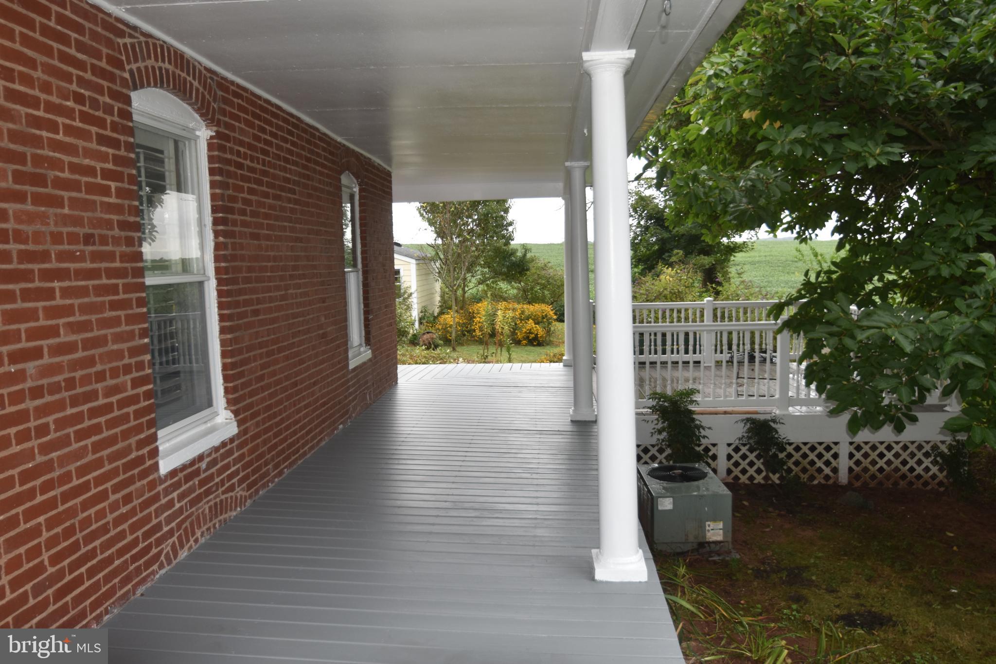 5619 A Jefferson Pike Frederick, MD 21703 - Photo 6 of 57 a view of a balcony with wooden floor