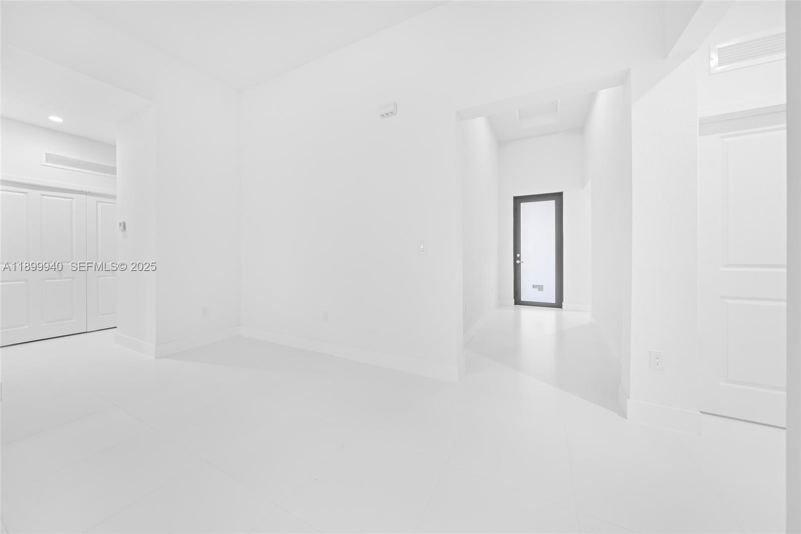 19504 Southwest 324th Street Homestead, FL 33030 - Photo 33 of 46 foyer, door to bed #4 and laundry