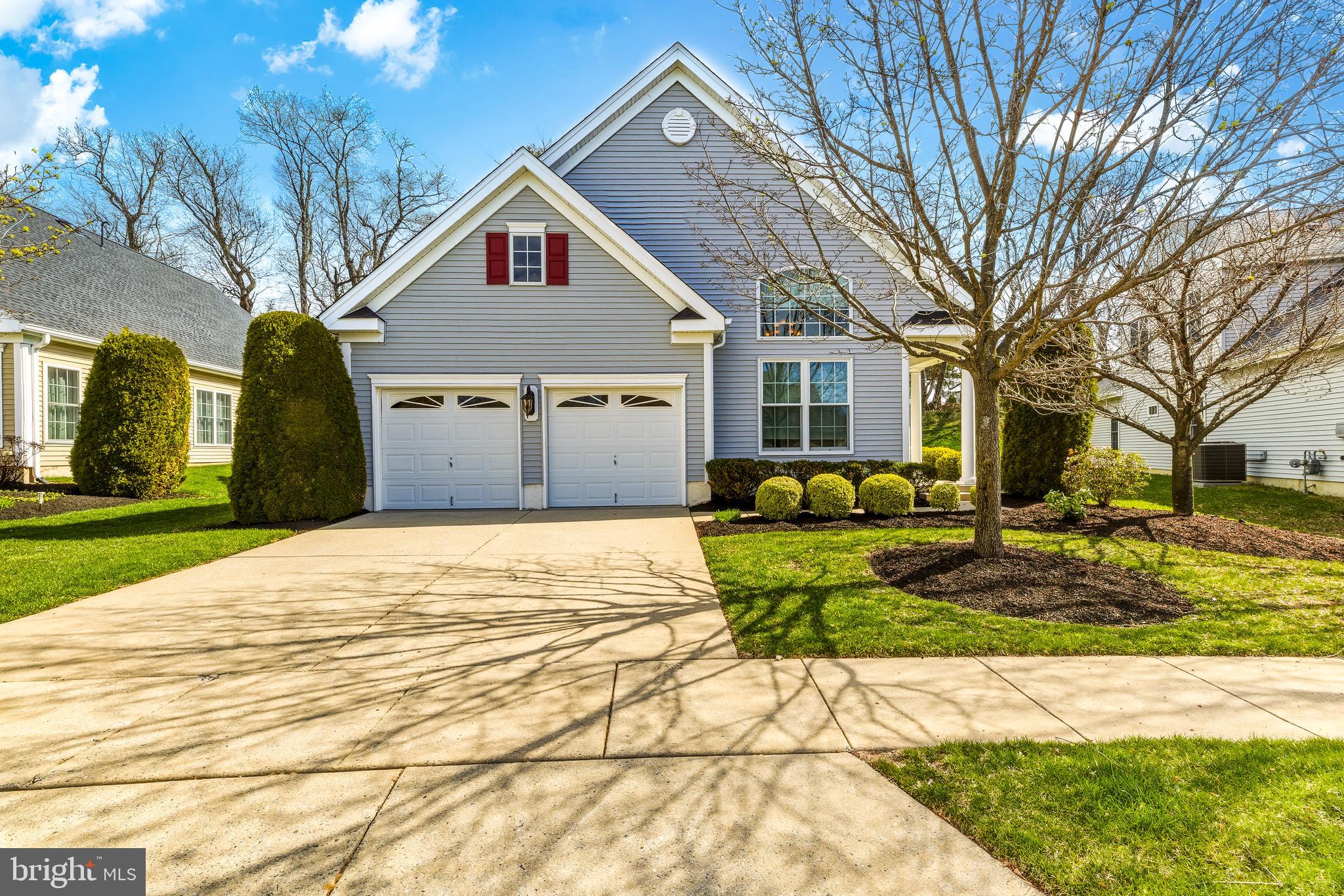 a view of a house with a yard covered in snow