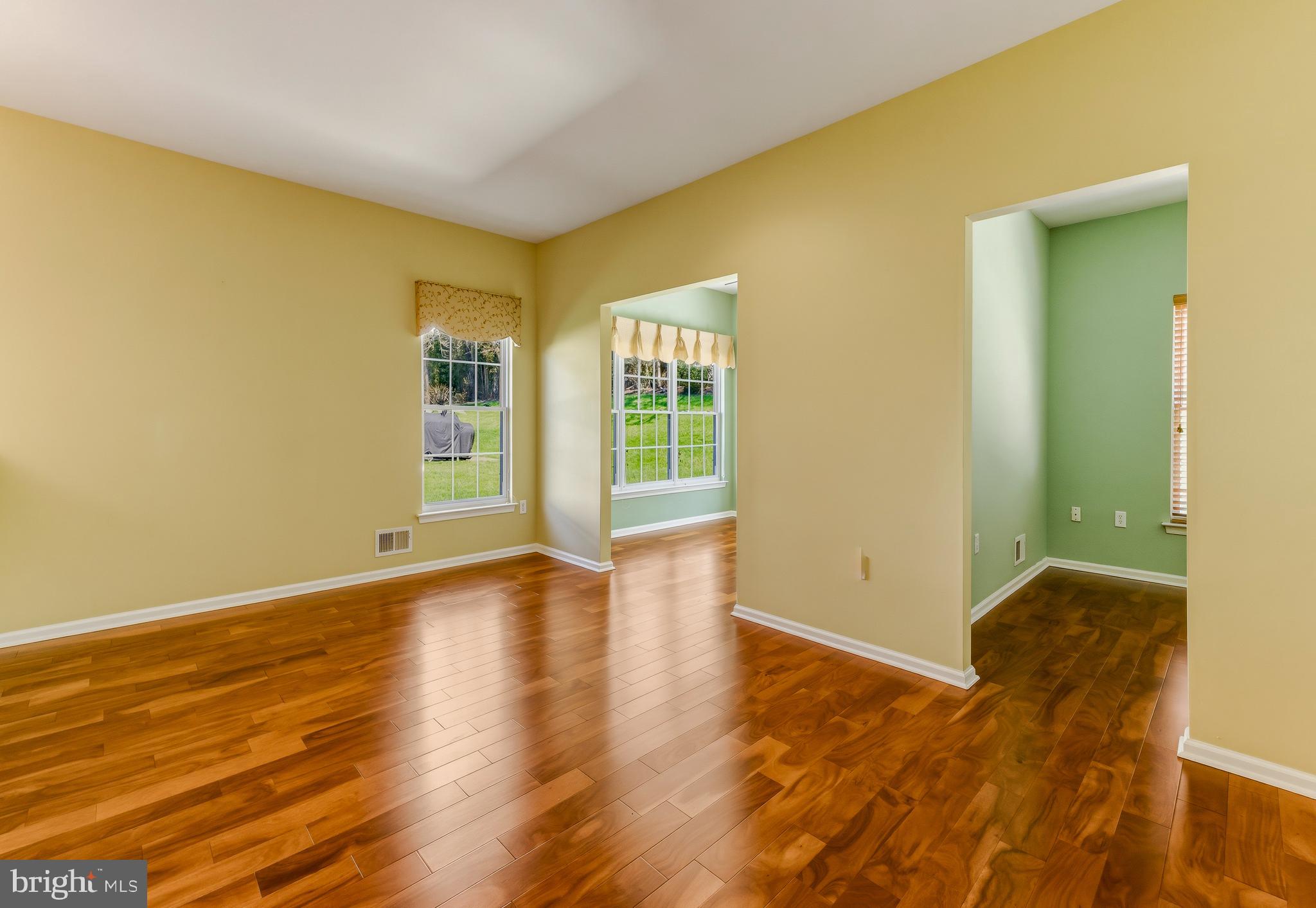 106 York Road West Deptford, NJ 08086 - Photo 14 of 31 a view of an empty room with wooden floor and a window