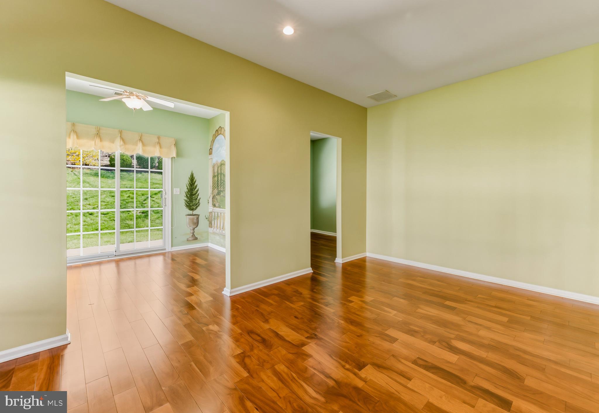106 York Road West Deptford, NJ 08086 - Photo 15 of 31 a view of an empty room with wooden floor and a window