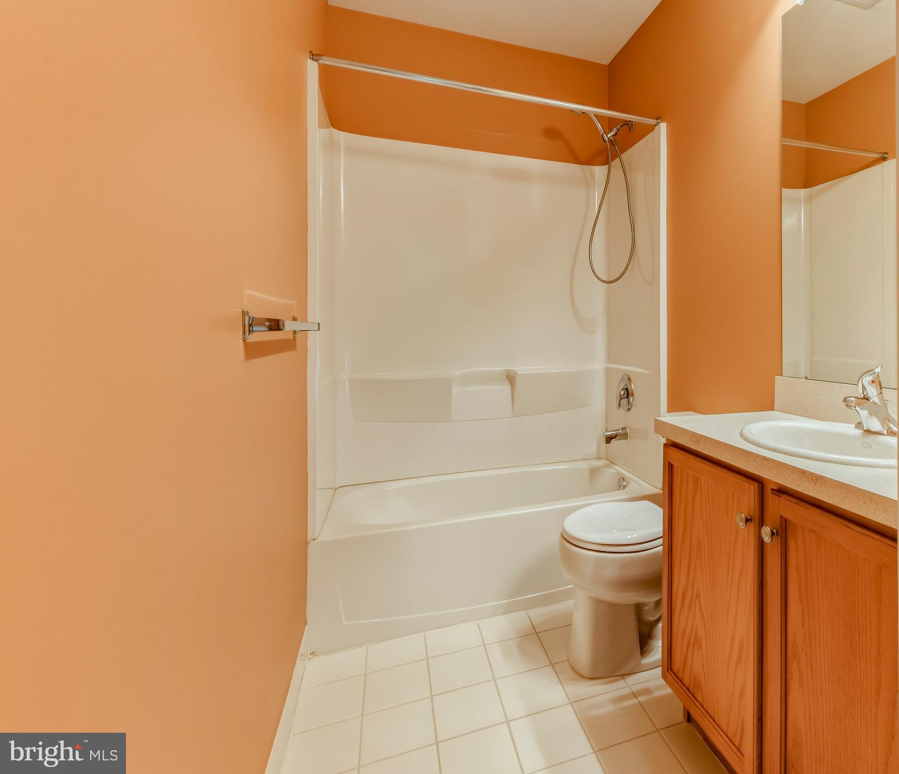 106 York Road West Deptford, NJ 08086 - Photo 31 of 31 a bathroom with a granite countertop bathtub shower sink vanity and toilet
