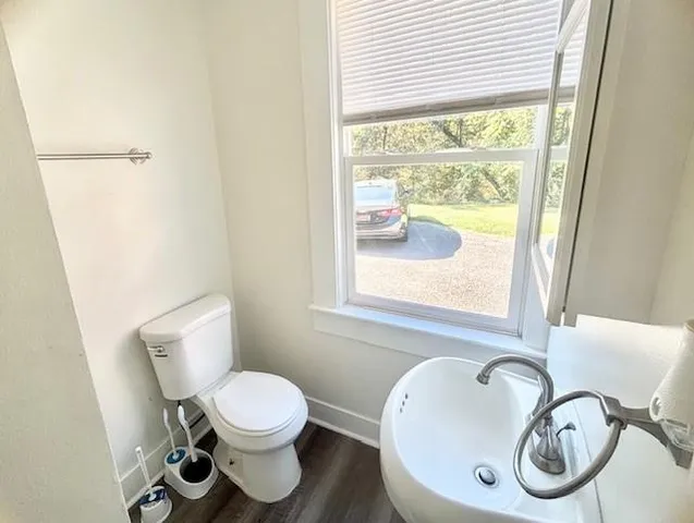 a bathroom with a toilet and a sink