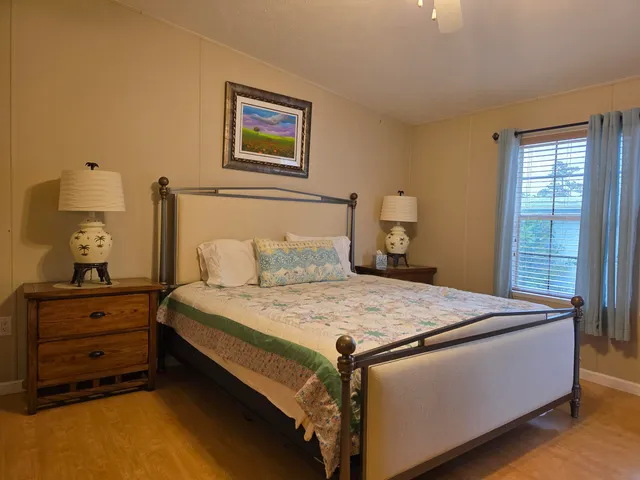 a bed room with a bed and a window