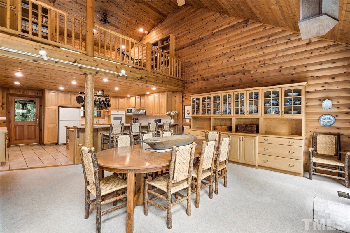 1625 Rougemont Road Rougemont, NC 27572 - Photo 12 of 30 a dining hall with stainless steel appliances kitchen island granite countertop a table and chairs