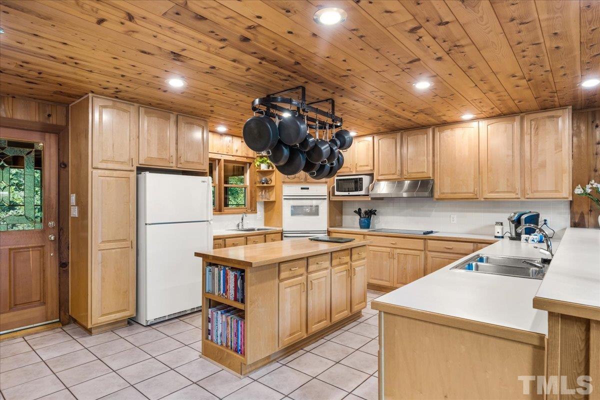 1625 Rougemont Road Rougemont, NC 27572 - Photo 13 of 30 a kitchen that has a sink a stove and a refrigerator