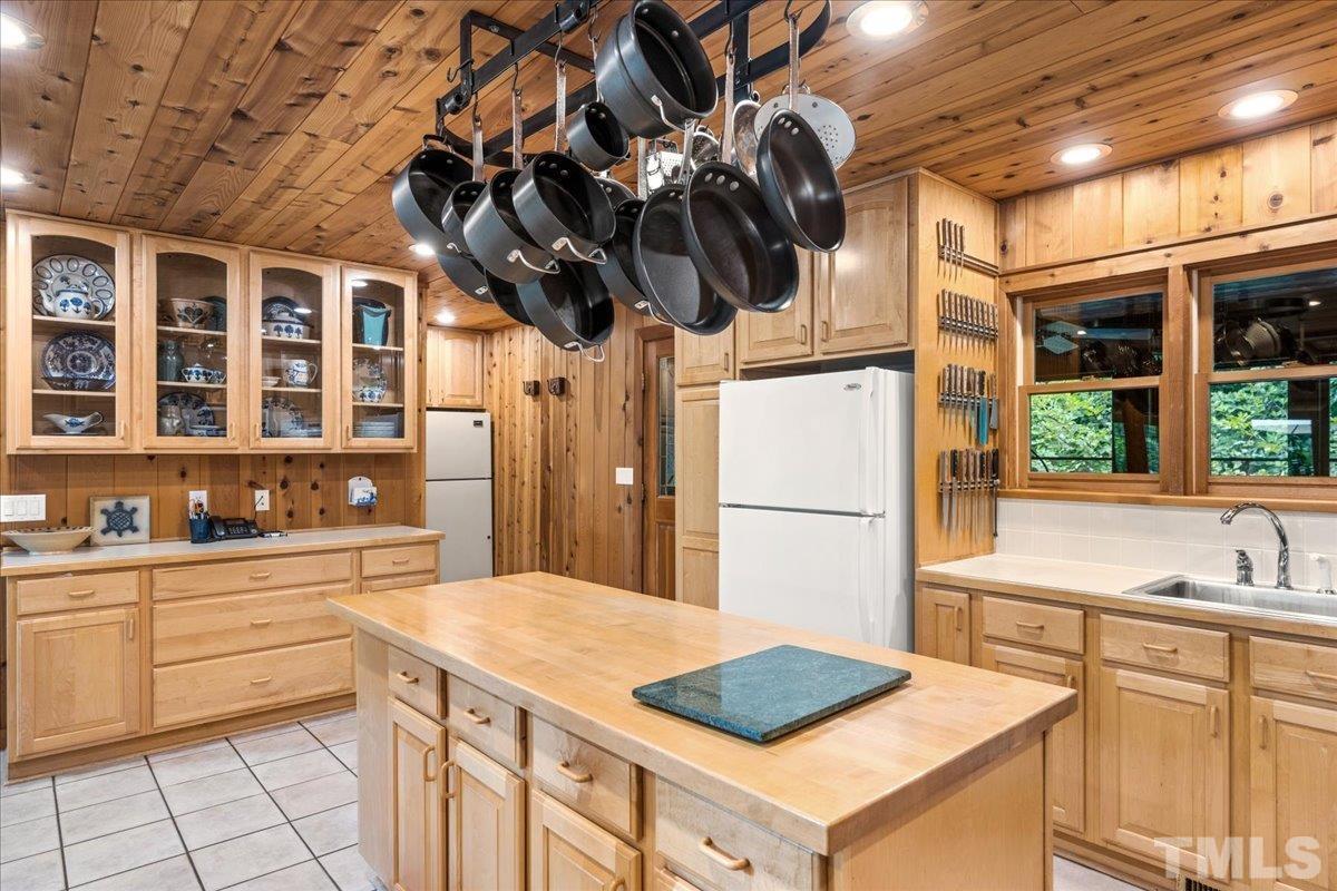 1625 Rougemont Road Rougemont, NC 27572 - Photo 14 of 30 a kitchen with a sink a stove and a refrigerator