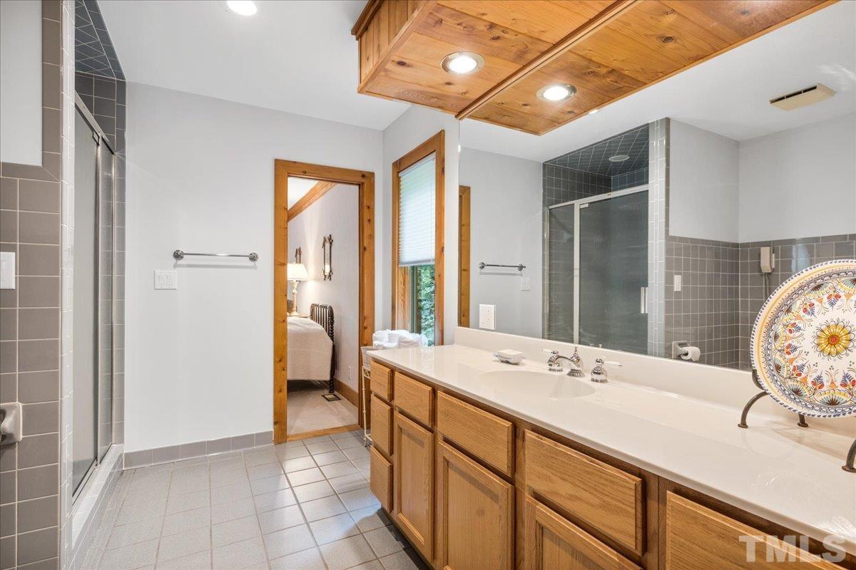 1625 Rougemont Road Rougemont, NC 27572 - Photo 18 of 30 a spacious bathroom with a double vanity sink and a mirror