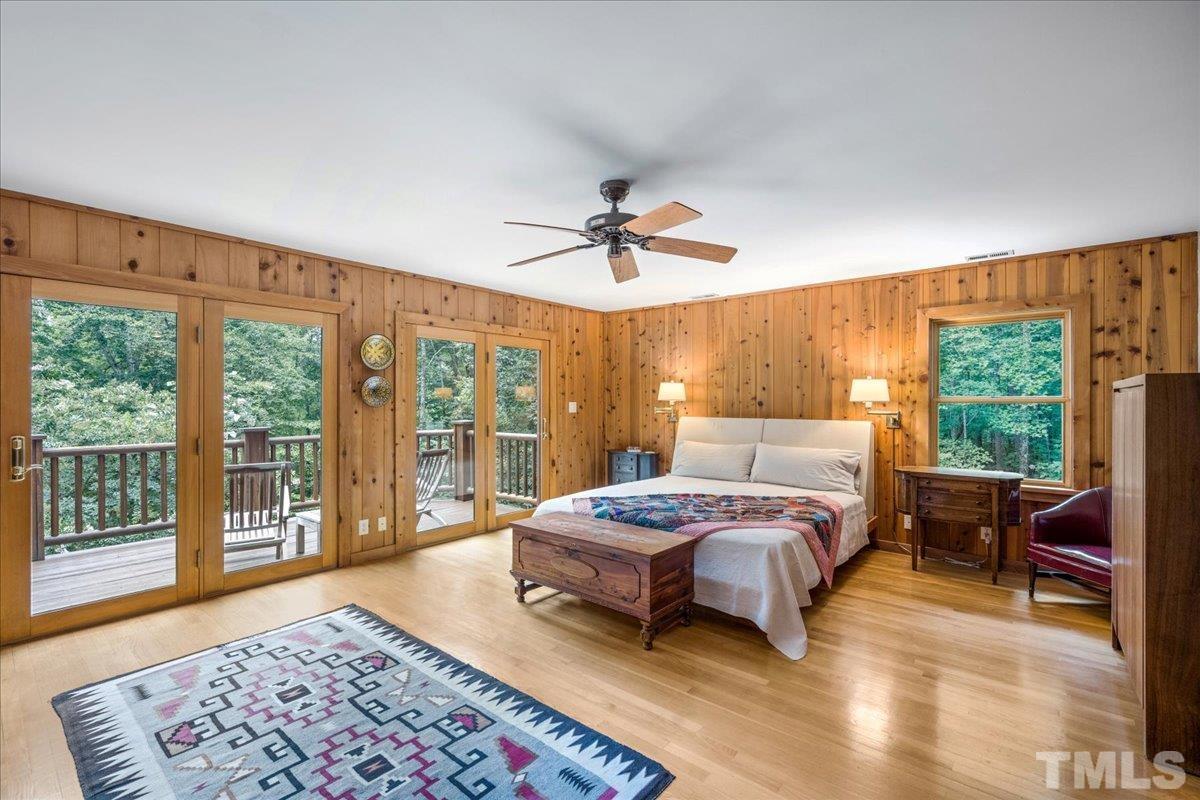 1625 Rougemont Road Rougemont, NC 27572 - Photo 24 of 30 a bedroom with a large bed and a large window