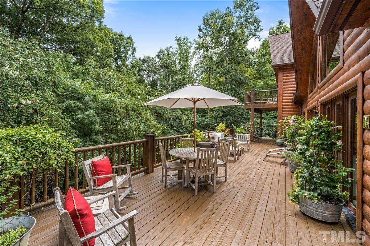 1625 Rougemont Road Rougemont, NC 27572 - Photo 6 of 30 a view of a chairs and table on the wooden deck