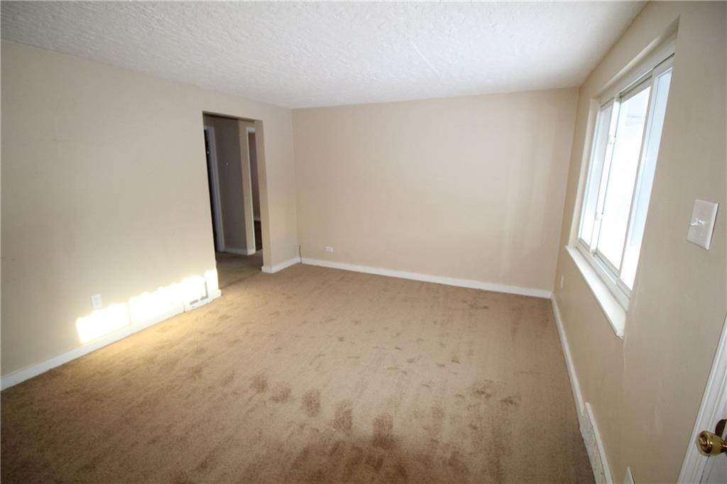 162 Castle Road Pittsburgh, PA 15234 - Photo 2 of 18 Brand new carpeting in the living room.