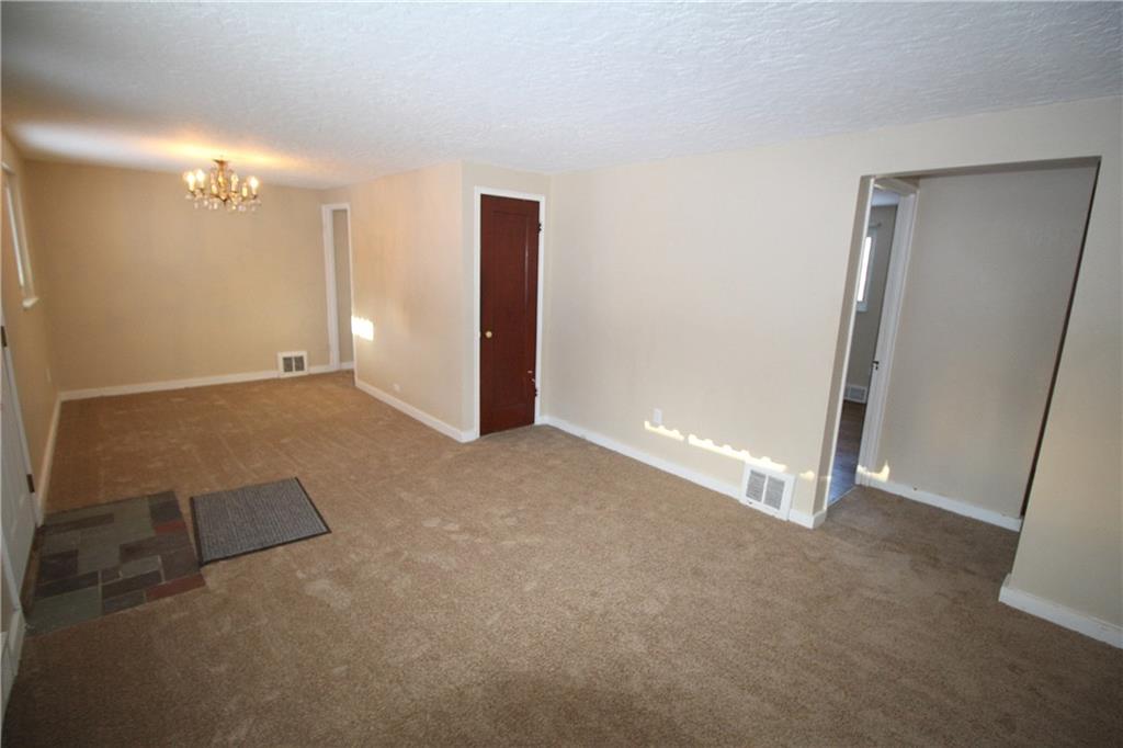 162 Castle Road Pittsburgh, PA 15234 - Photo 5 of 18 Living and dining rooms. Guest closet for coats.