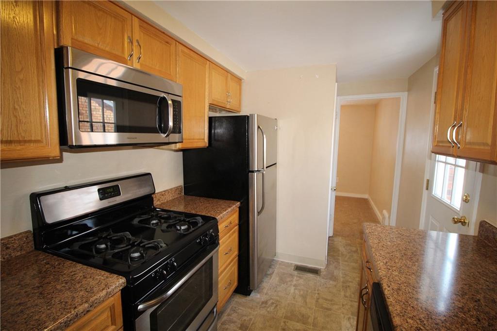 162 Castle Road Pittsburgh, PA 15234 - Photo 7 of 18 The kitchen includes stainless steel appliances.