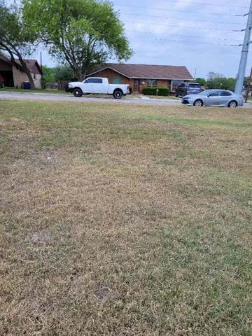 a view of a building with a yard