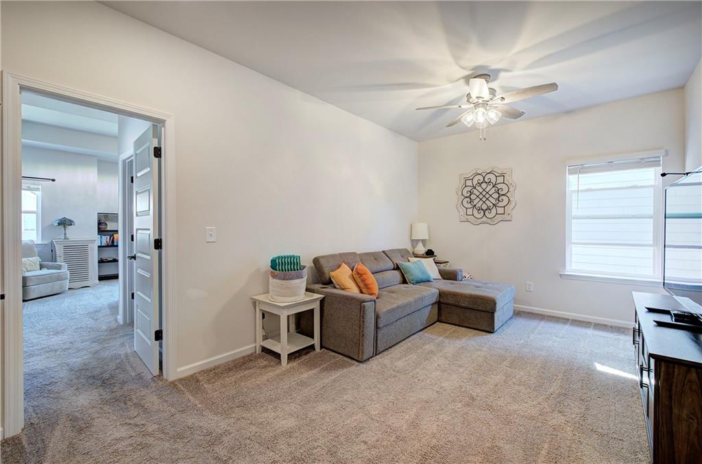 402 Perth Drive Cartersville, GA 30121 - Photo 27 of 31 a view of a livingroom with furniture and a chandelier fan