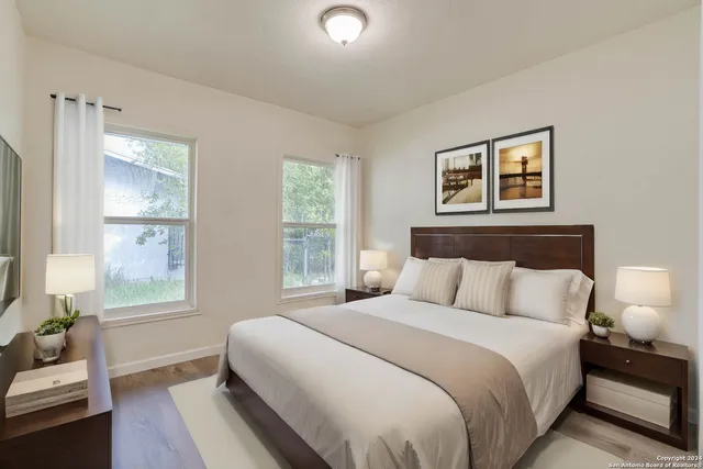 a bedroom with a bed and a couch