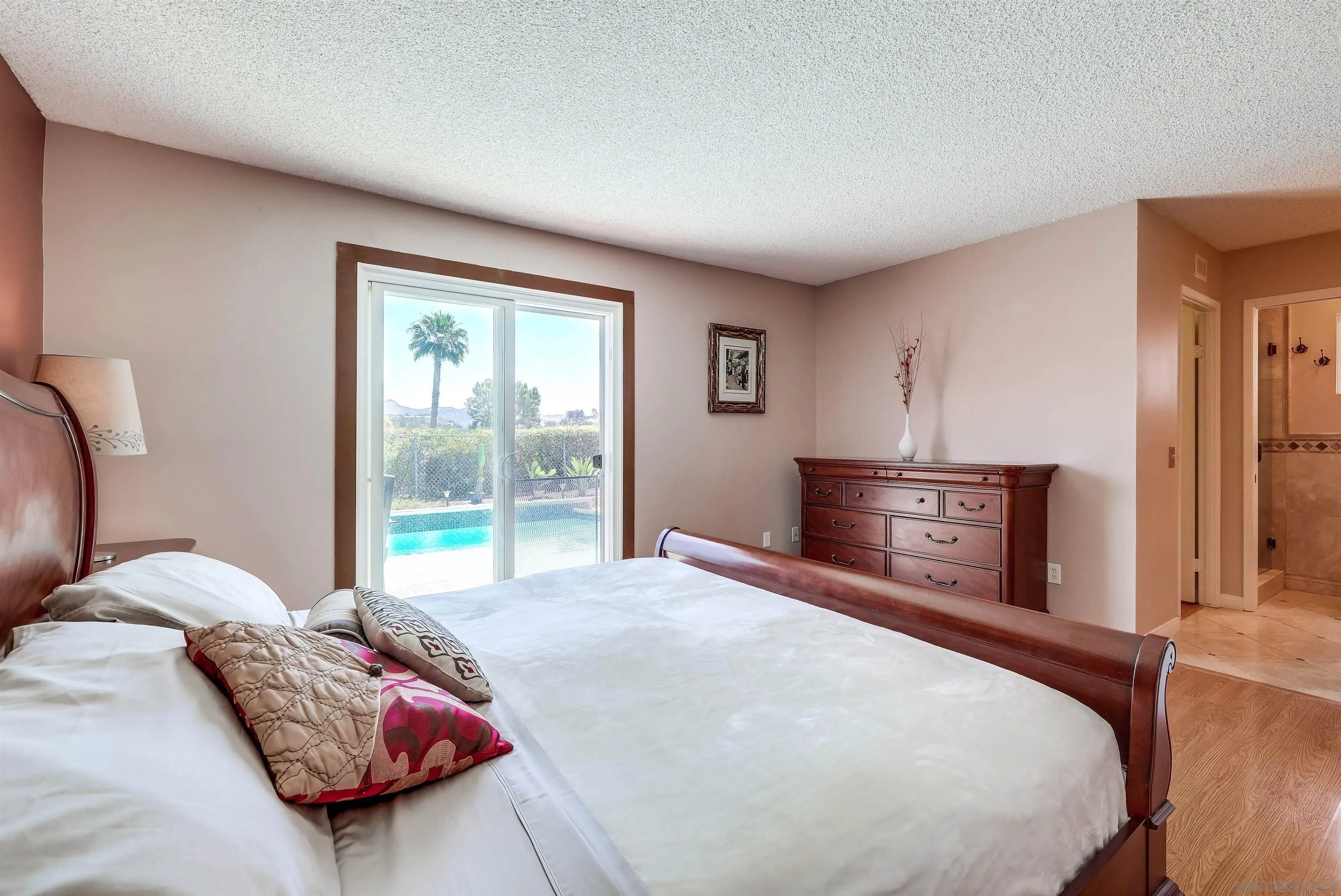 14039 Hermosillo Way Poway, CA 92064 - Photo 11 of 31 a bedroom with a bed and a window