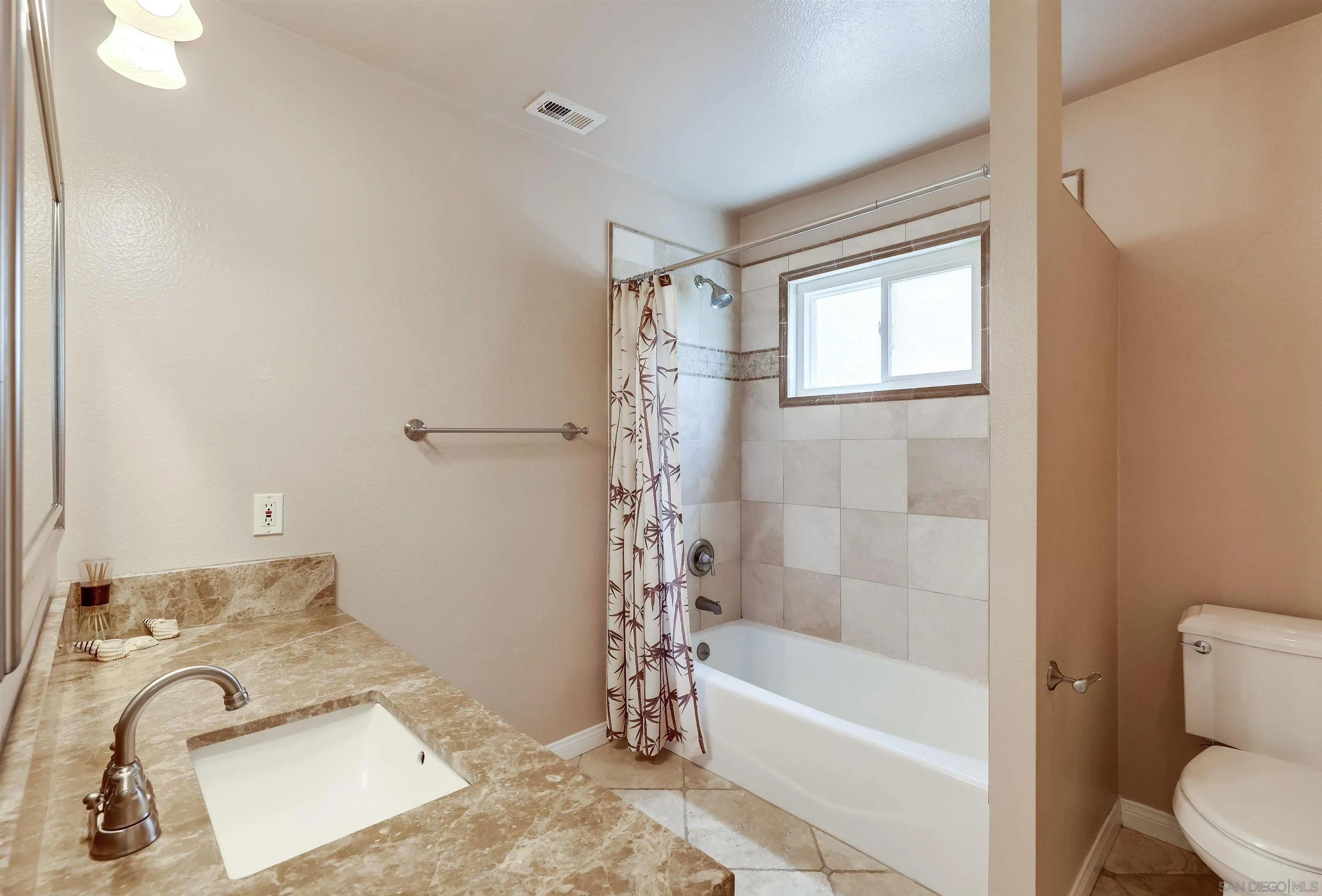 14039 Hermosillo Way Poway, CA 92064 - Photo 12 of 31 a bathroom with a bathtub and shower