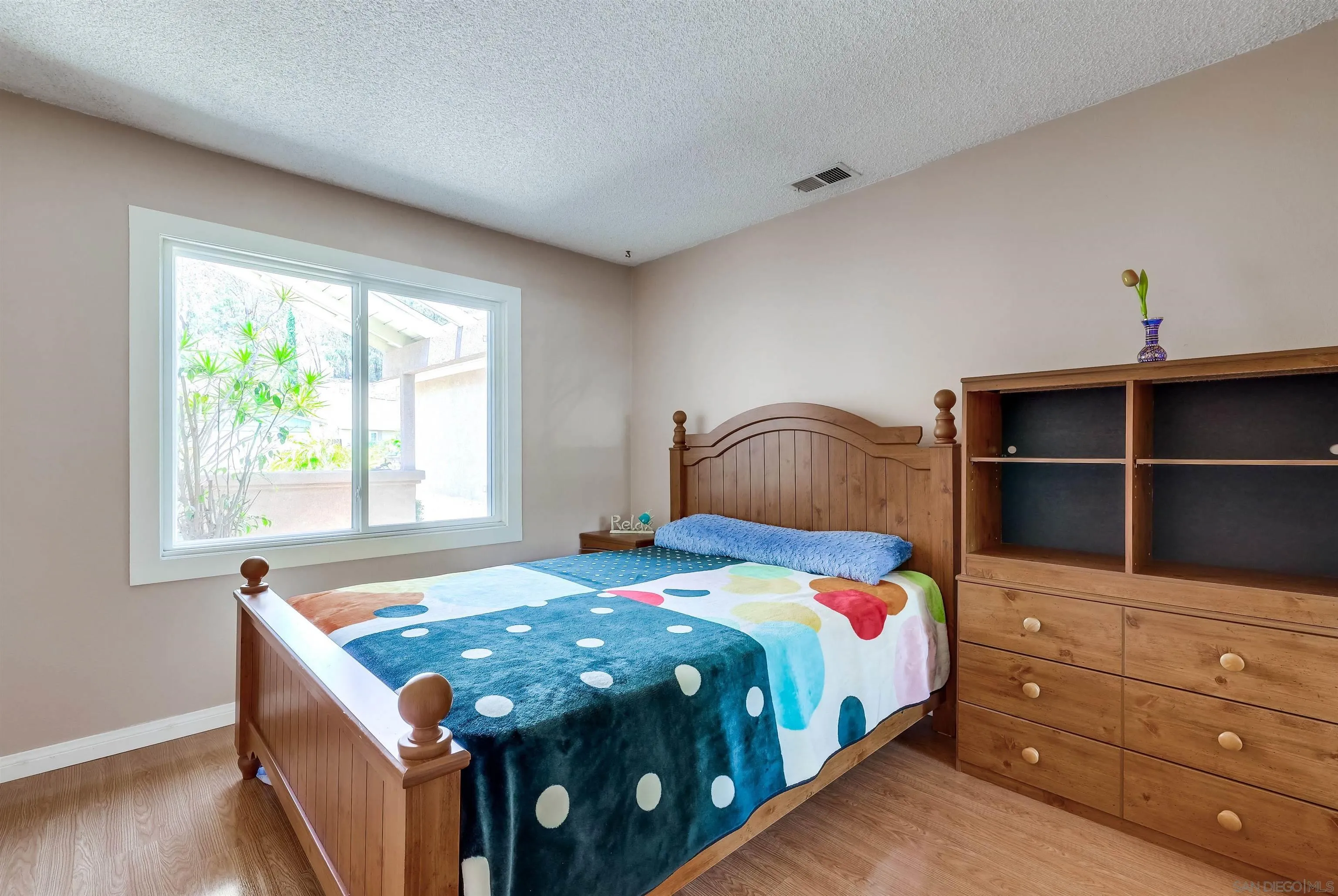 14039 Hermosillo Way Poway, CA 92064 - Photo 13 of 31 a bedroom with a bed and a window