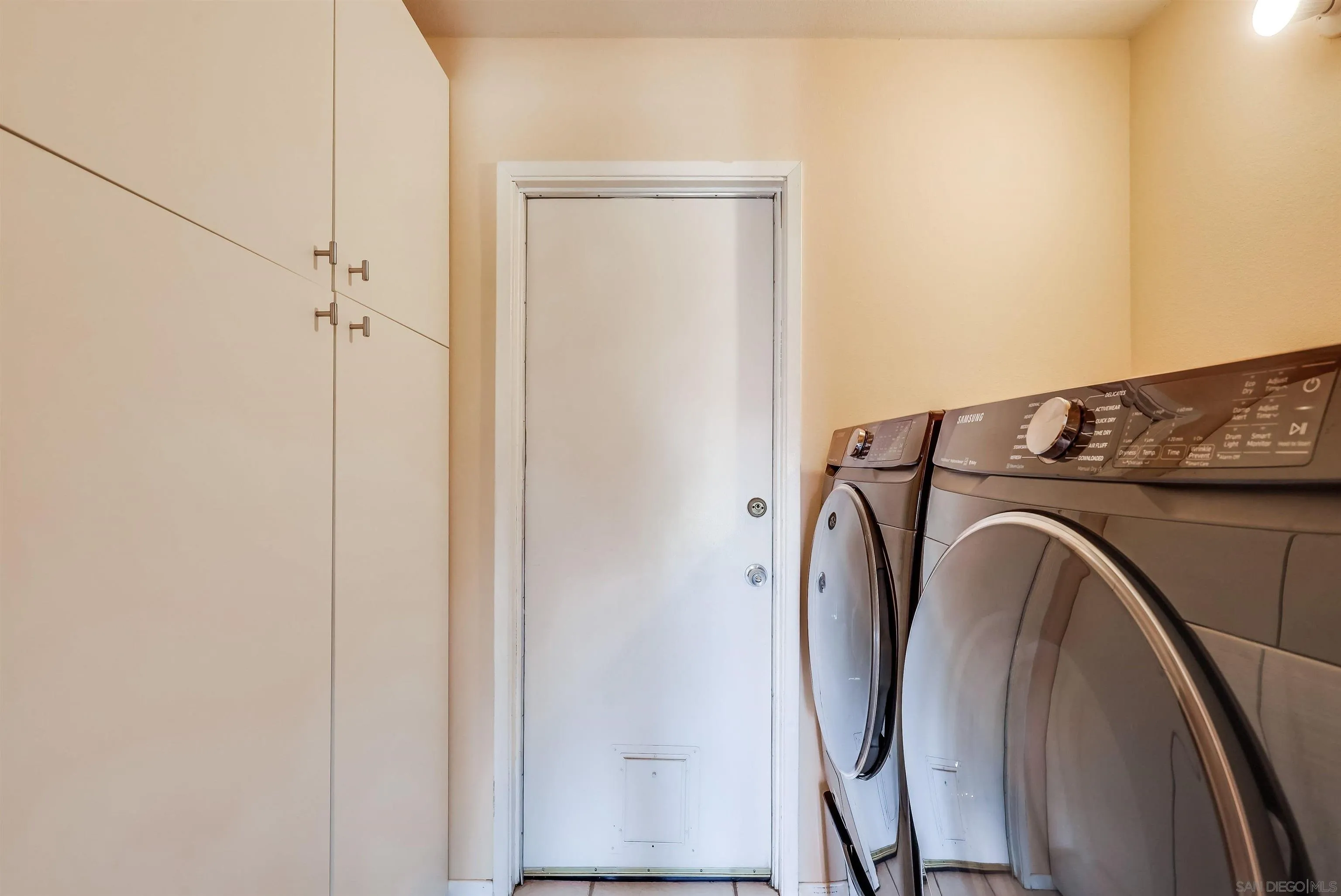 14039 Hermosillo Way Poway, CA 92064 - Photo 16 of 31 a utility room with dryer and washer