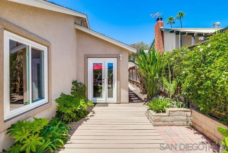 14039 Hermosillo Way Poway, CA 92064 - Photo 25 of 31 a front view of a house with plants