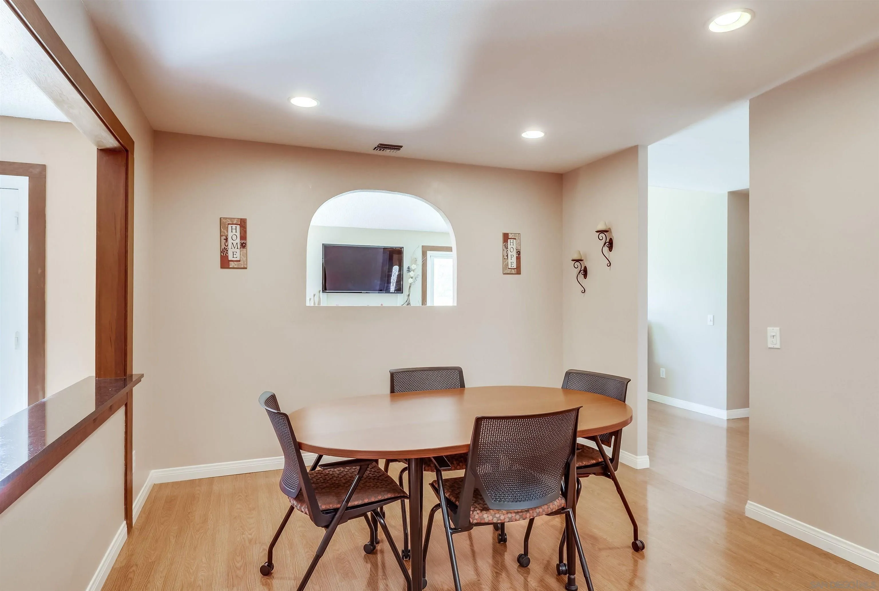 14039 Hermosillo Way Poway, CA 92064 - Photo 7 of 31 a view of a dining room with furniture and wooden floor