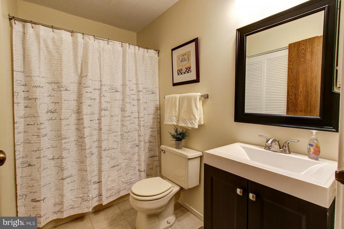 11872 Lester Road Manassas, VA 20112 - Photo 17 of 21 Updated Hall Bath, New Vanity, Tile and Lighting