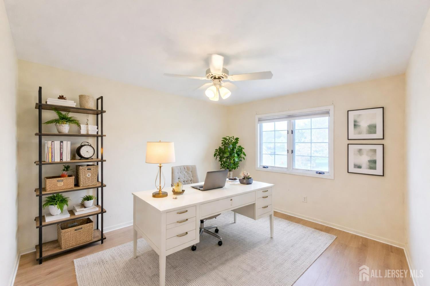 1 H Rutland Lane Monroe Township, NJ 08831 - Photo 12 of 26 a living room with furniture a chandelier and a window
