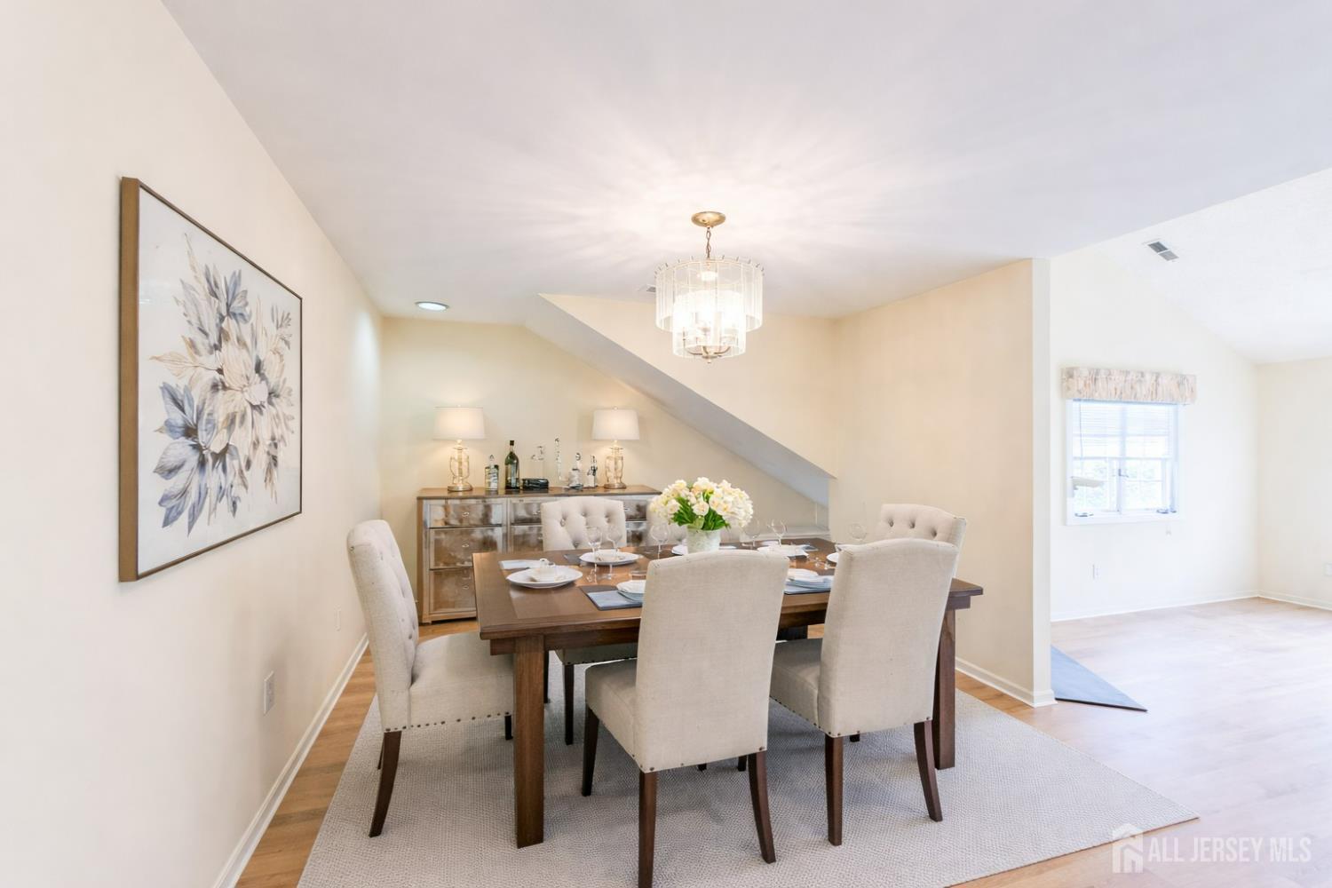 1 H Rutland Lane Monroe Township, NJ 08831 - Photo 15 of 26 a view of a dining room with furniture