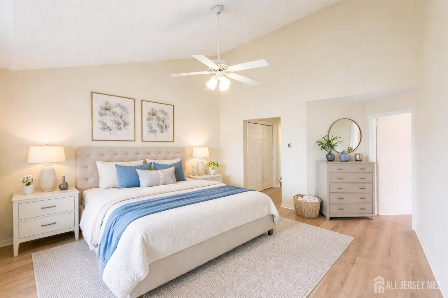 1 H Rutland Lane Monroe Township, NJ 08831 - Photo 23 of 26 a bedroom with a bed and a chandelier