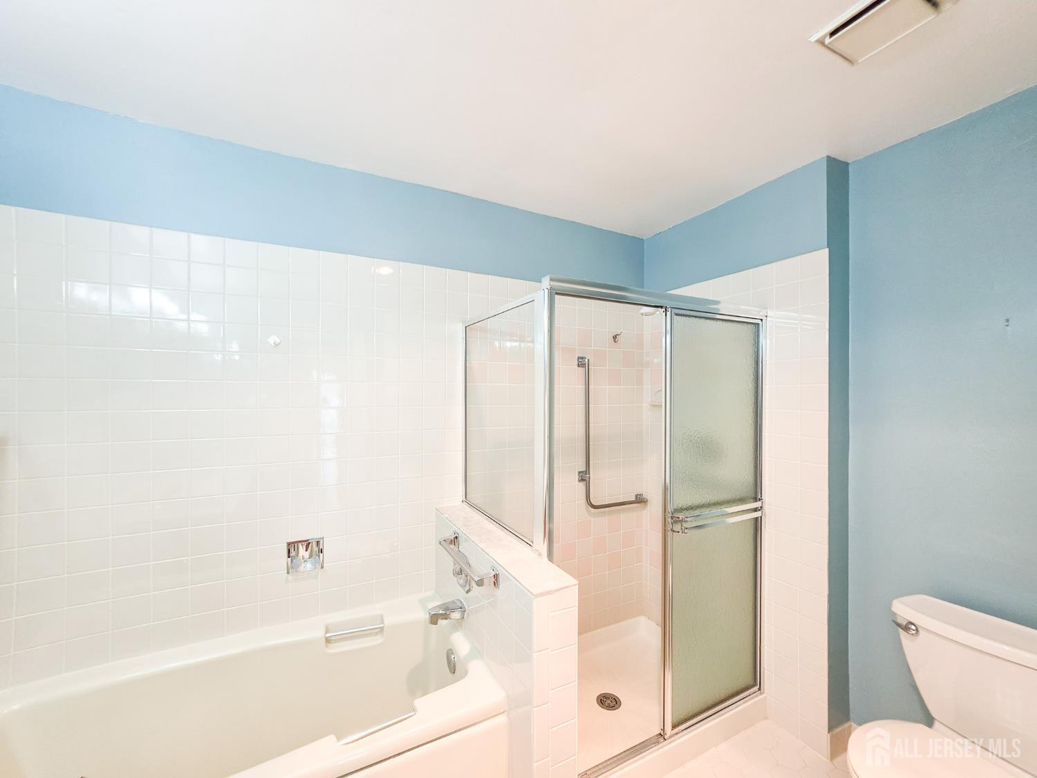 1 H Rutland Lane Monroe Township, NJ 08831 - Photo 26 of 26 a bathroom with a shower and a toilet