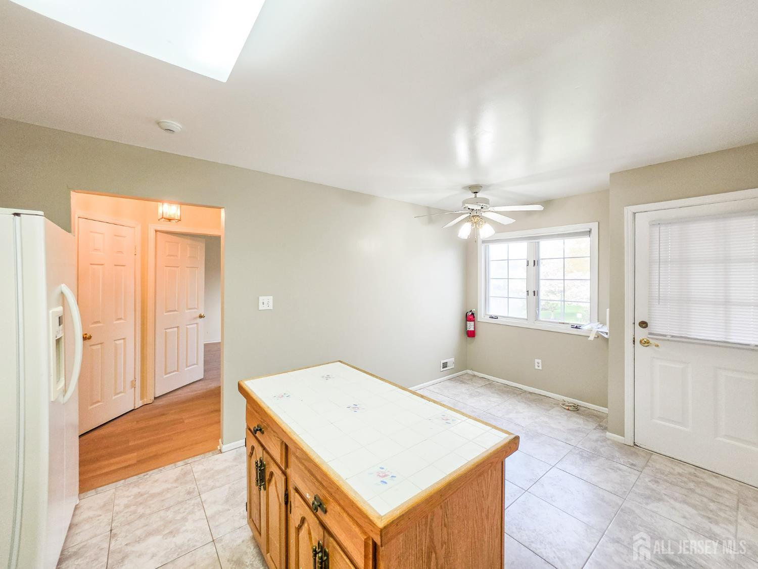 1 H Rutland Lane Monroe Township, NJ 08831 - Photo 6 of 26 a view of livingroom with hardwood floor and front door